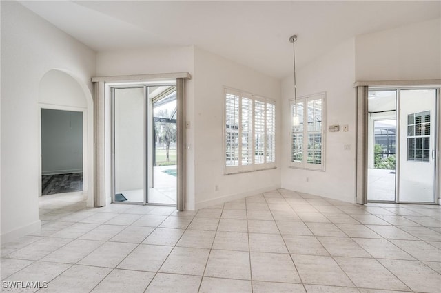 unfurnished dining area featuring light tile patterned floors