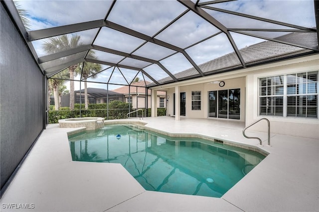 view of swimming pool featuring an in ground hot tub, glass enclosure, and a patio