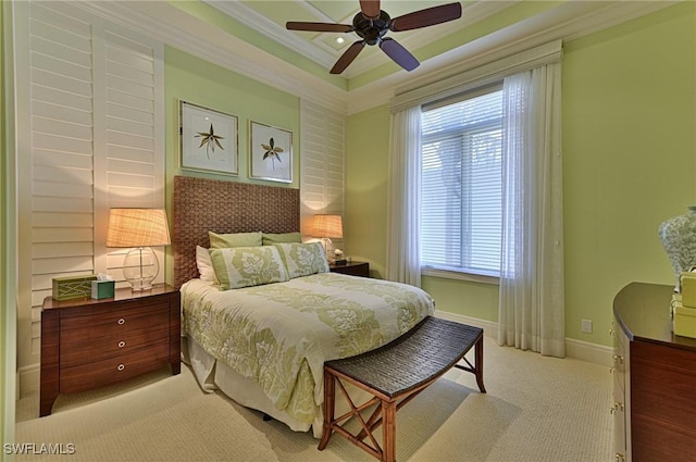 carpeted bedroom featuring ornamental molding and ceiling fan