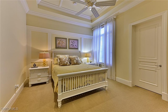 carpeted bedroom featuring crown molding and ceiling fan