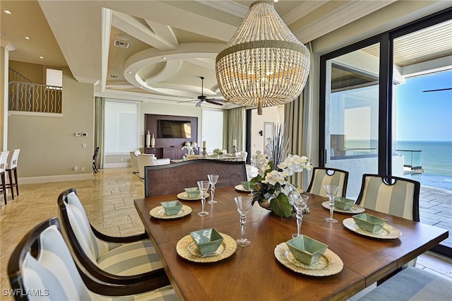 dining room featuring crown molding and ceiling fan with notable chandelier