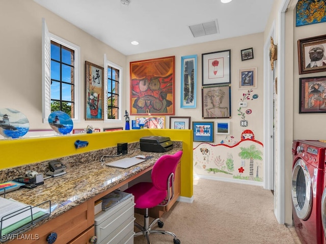 office area with washer and dryer and light carpet