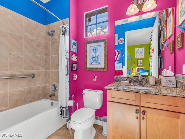 full bathroom with tile patterned floors, vanity, toilet, and shower / bath combination with curtain