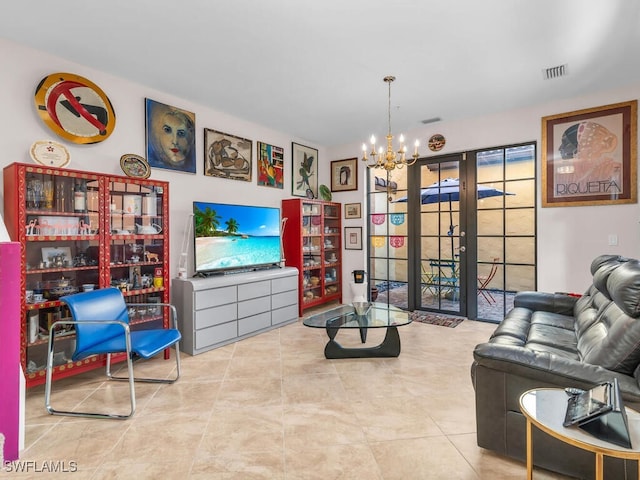 living room featuring french doors, a chandelier, and light tile patterned flooring