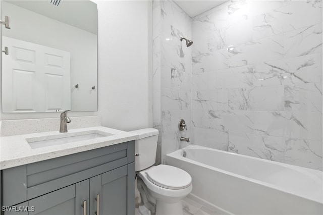 full bathroom with toilet, tiled shower / bath combo, and vanity