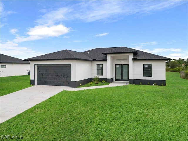 prairie-style home with a front yard and a garage