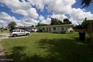 ranch-style house featuring a front yard