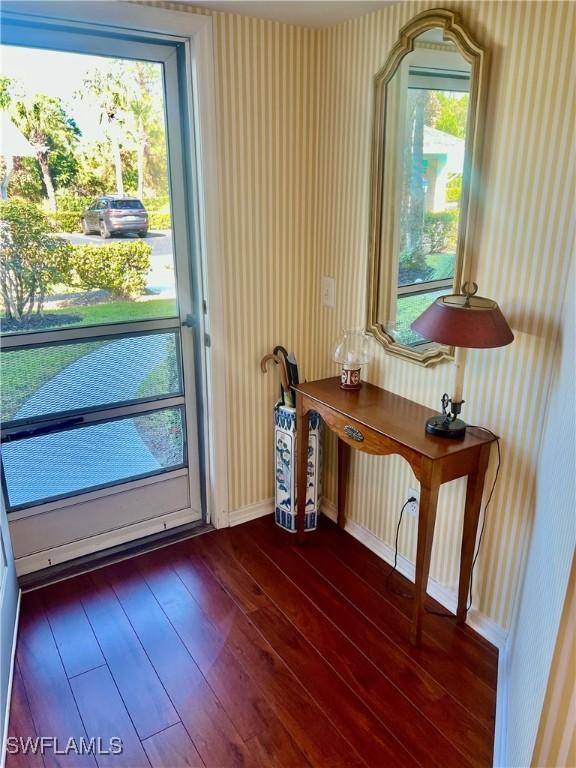 entryway with dark wood-type flooring