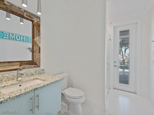 bathroom featuring tile patterned floors, toilet, and vanity