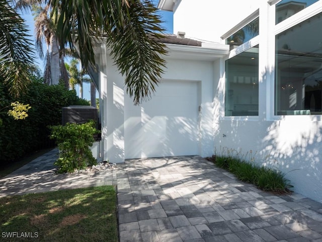 view of side of property with a garage