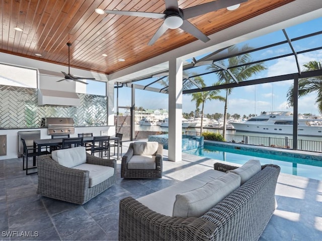 view of patio / terrace with an outdoor living space, ceiling fan, glass enclosure, and area for grilling