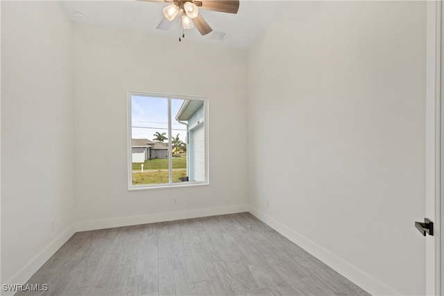 spare room with light hardwood / wood-style floors and ceiling fan