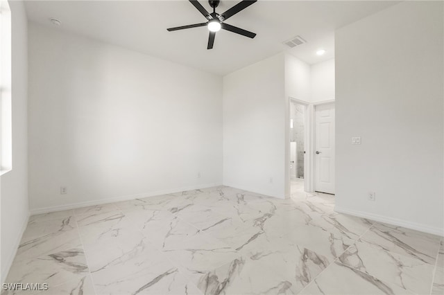 empty room featuring ceiling fan, recessed lighting, visible vents, baseboards, and marble finish floor