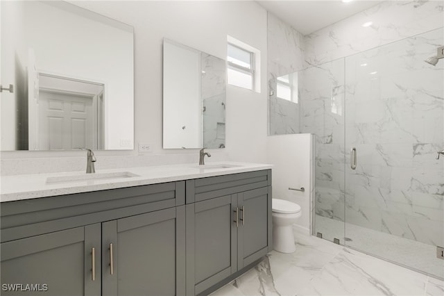 bathroom with marble finish floor, a sink, a marble finish shower, and toilet