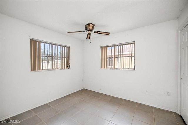 spare room with ceiling fan