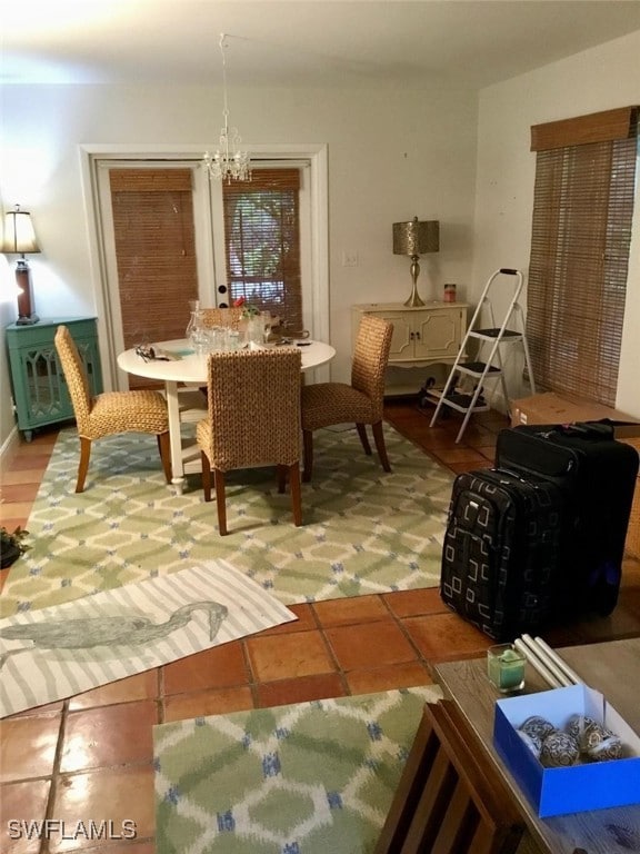 dining area featuring a notable chandelier