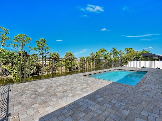 4116 NE 21st Pl, Cape Coral, FL 33909 - view of swimming pool with a patio, a fenced in pool, and fence