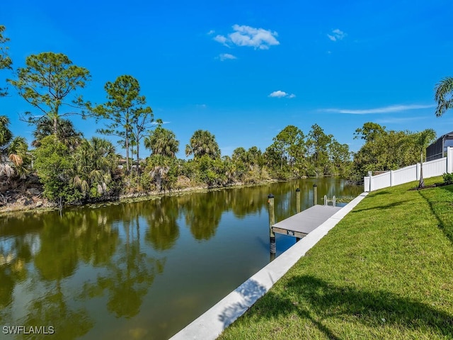 4116 NE 21st Pl, Cape Coral, FL 33909 - view of dock featuring a lawn, a water view, and fence