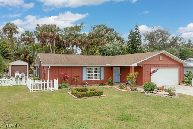 single story home featuring a garage and a front yard