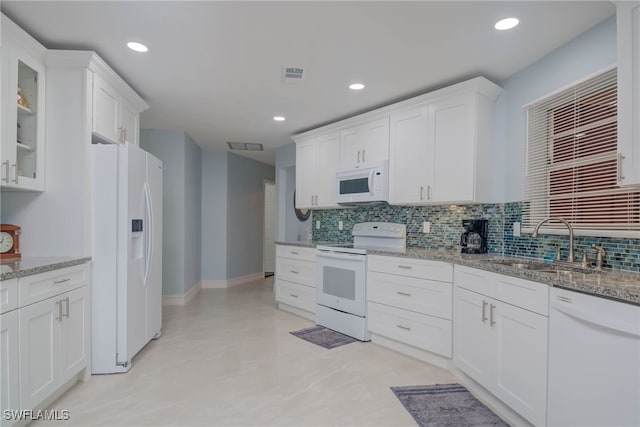 kitchen featuring white cabinetry, white appliances, sink, and light stone counters