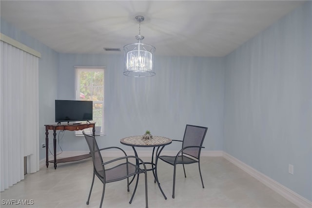 dining room with a notable chandelier