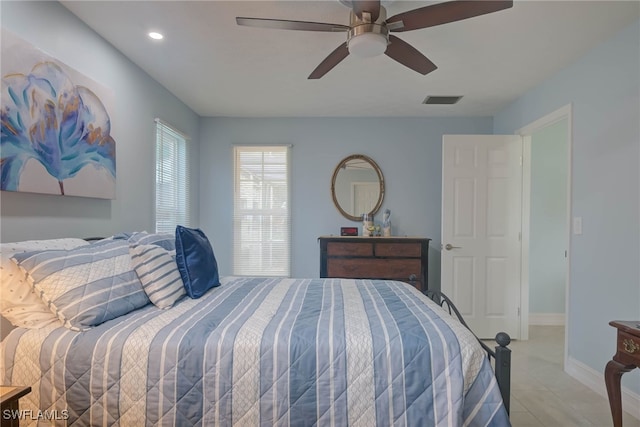 bedroom featuring light tile patterned floors and ceiling fan