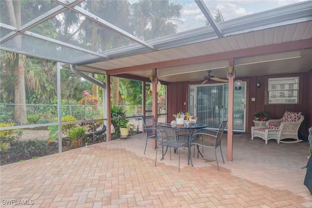 sunroom / solarium with ceiling fan