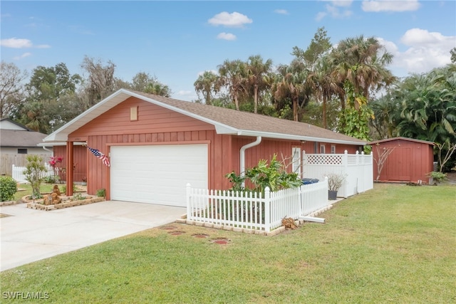 garage featuring a lawn