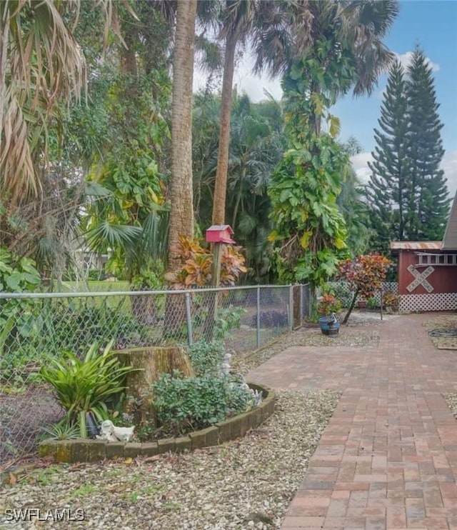 14943 Randolph Dr, Fort Myers, FL 33905 - view of yard with an outdoor structure, fence, and a patio