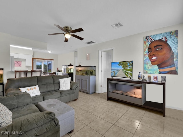 tiled living room with ceiling fan