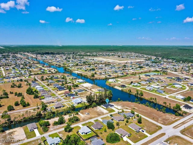 bird's eye view with a residential view and a water view