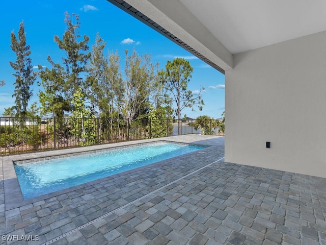 view of pool with a patio, fence, and a fenced in pool