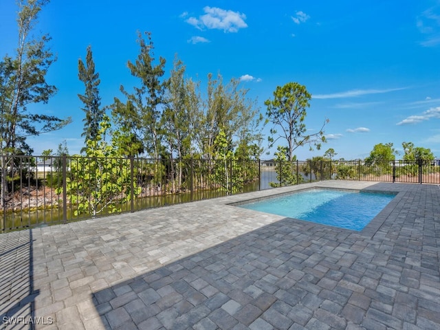 view of pool with a fenced in pool, fence, and a patio