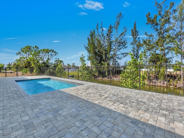 view of pool with fence, a fenced in pool, and a patio area