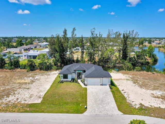 birds eye view of property with a water view and a residential view