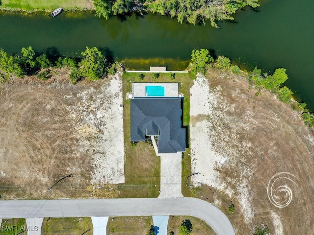 birds eye view of property with a water view