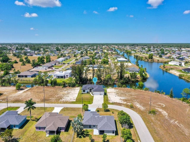aerial view with a water view and a residential view
