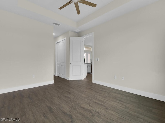 interior space with dark wood-style flooring, ceiling fan, recessed lighting, baseboards, and visible vents