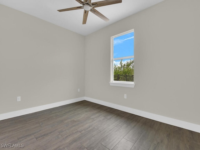 unfurnished room with baseboards, a ceiling fan, and wood finished floors