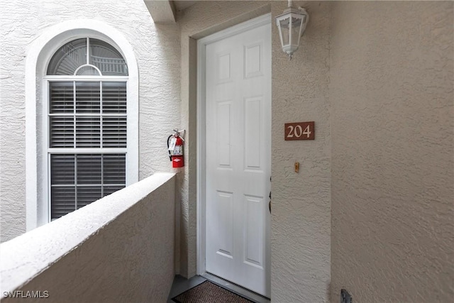 doorway to property featuring a balcony