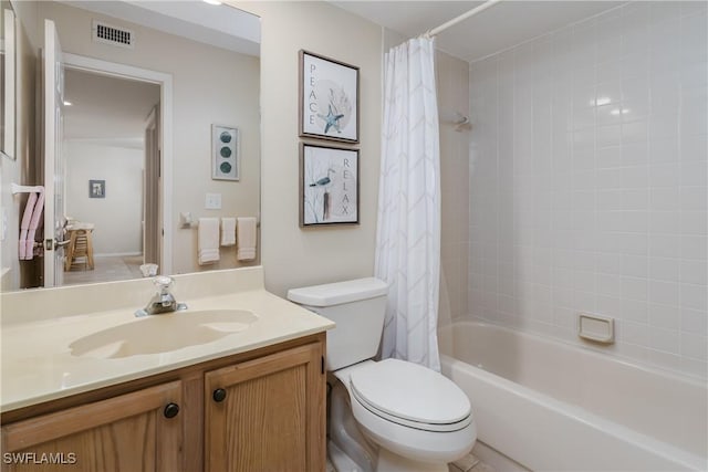 full bathroom featuring shower / tub combo with curtain, vanity, and toilet