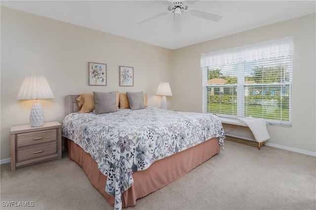 bedroom with light colored carpet and ceiling fan