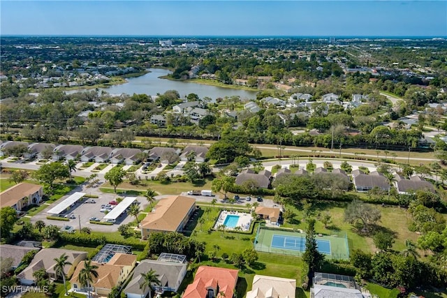 birds eye view of property with a water view