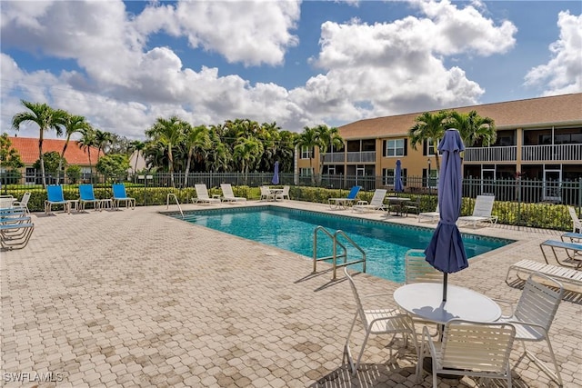 view of swimming pool featuring a patio