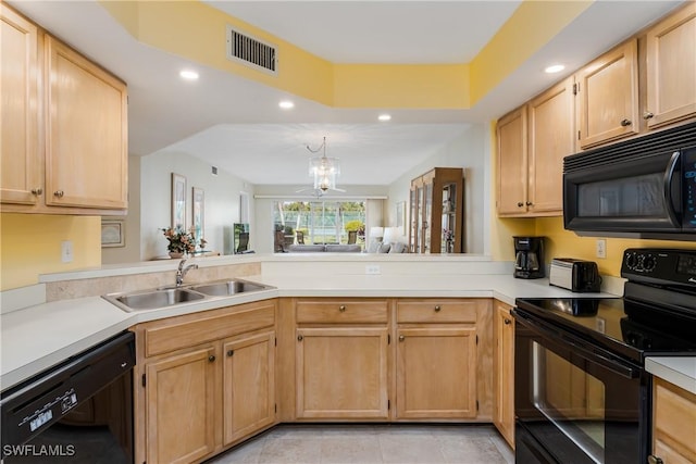 kitchen with light brown cabinetry, sink, an inviting chandelier, kitchen peninsula, and black appliances