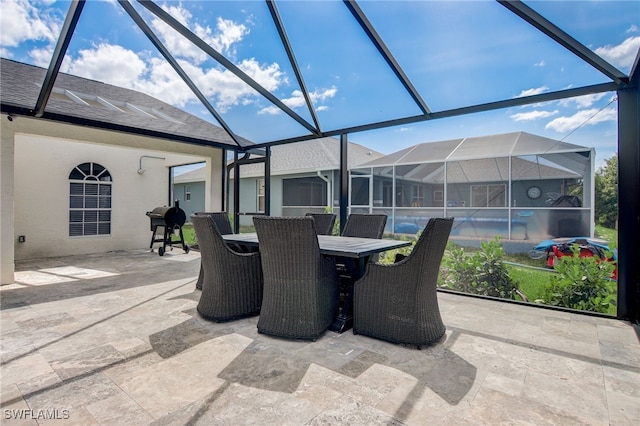 view of patio / terrace with glass enclosure and area for grilling