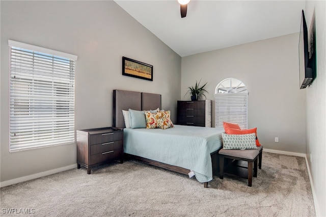 carpeted bedroom featuring ceiling fan and lofted ceiling