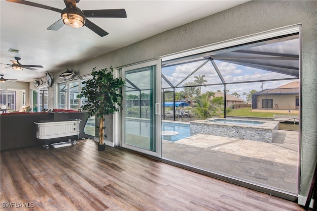 entryway with ceiling fan and hardwood / wood-style floors