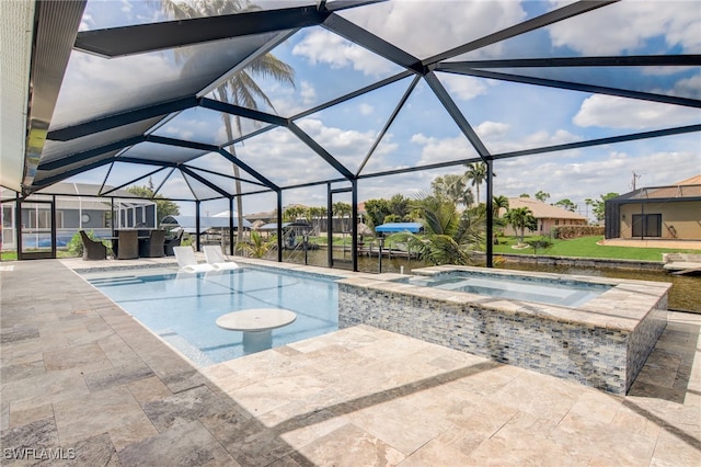 view of swimming pool with a patio area, glass enclosure, and an in ground hot tub