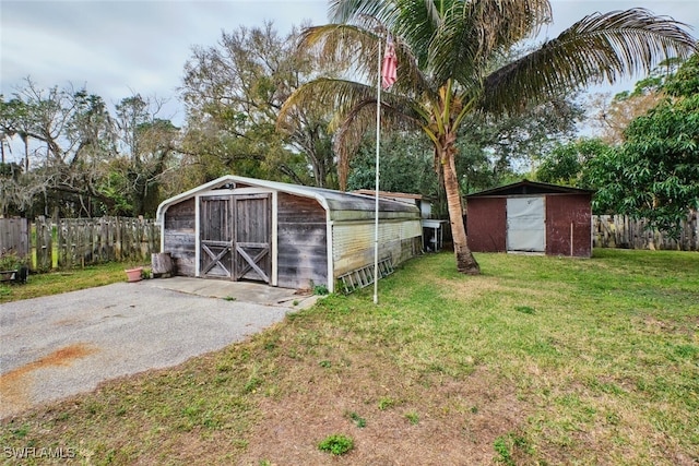 view of outdoor structure featuring a lawn